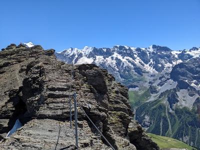 Near the summit of the Schilthorn. Only in Switzerland can you hike up ~5k feet of elevation gain, to arrive at a rotating restauraunt, get a burger, and take a gondola down. 